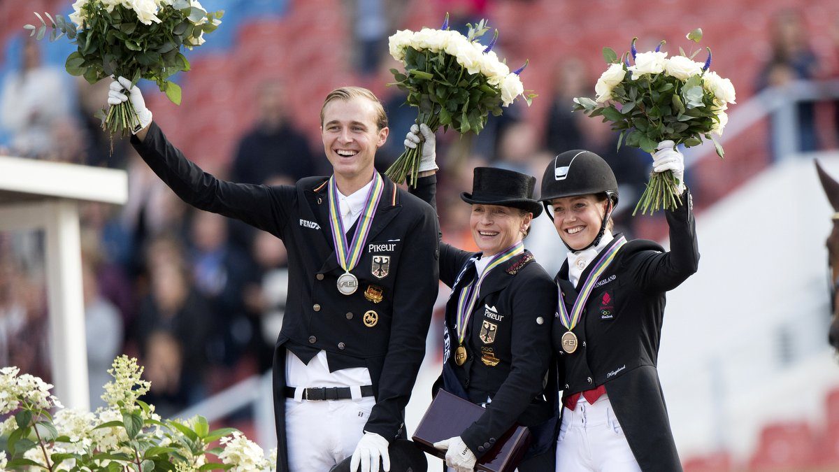 Sonke Rothenberger (zilver), Isabell Werth (goud) en de Deense Cathrine Dufour, die brons pakte. foto: FEI | Richard Juillart